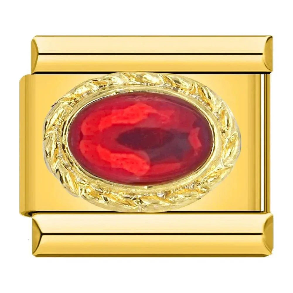 Pierre rouge sur or